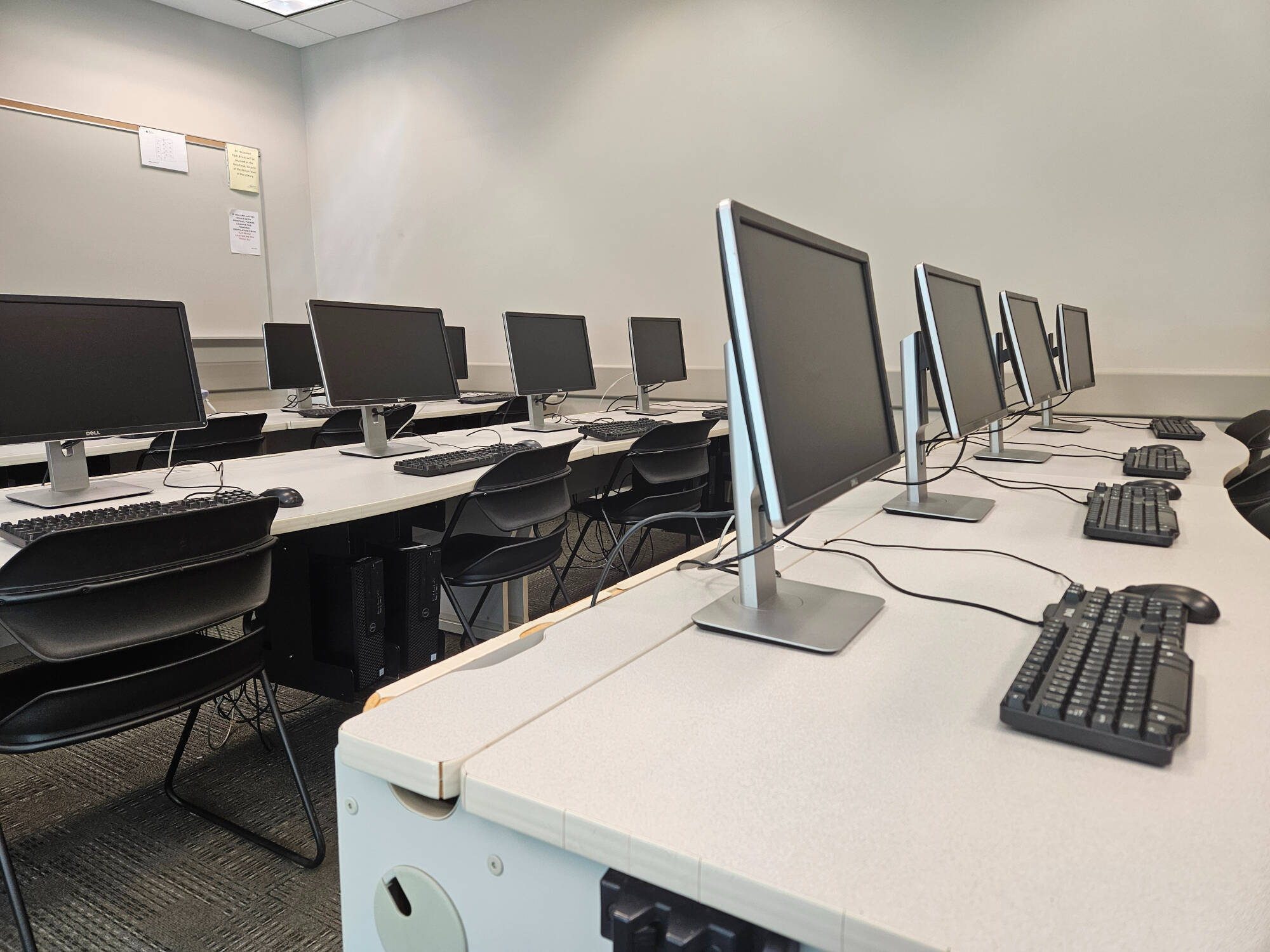 A row of computers in a computer lab